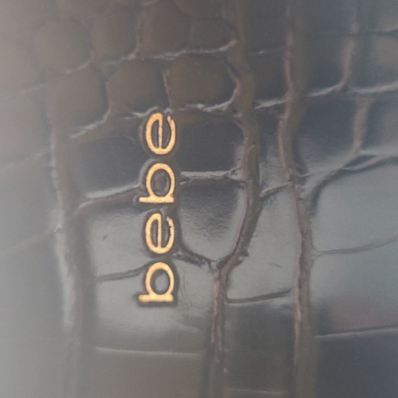 Bebe, Black Handbag. Handbag studs on bottom. Gold lettering. - Picture 4 of 4
